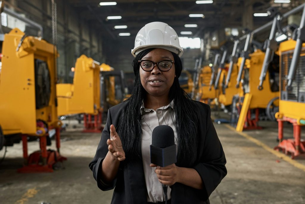 Woman reporting fresh news at factory